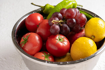 fresh vegetables and fruits in bowl .
