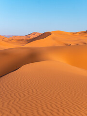 Fototapeta na wymiar Stunning sand dunes near Merzouga, Morocco during sunset - Landscape shot 4