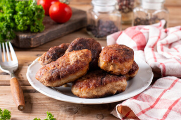 Pork cutlets from minced meat. Pan-fried meatballs. Healthy dinner for the family.
