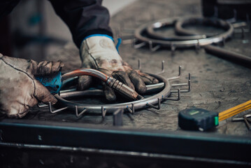 Close up of the steel welding process. Work in the heavy steel industry