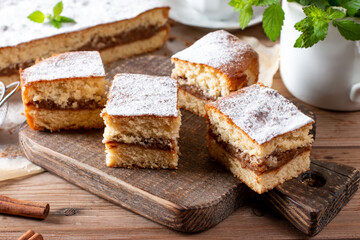 Fresh sponge cake with apples. Chiffon biscuit on table