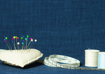 Accessories for sewing on a blue background