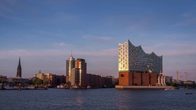 Time lapse of a very colorful sunset from Hamburg Waterfront in Northern Germany with the Iconic Elbphilharmonie building in front