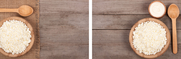 Cottage cheese in a wooden bowl with sour cream on old wooden background with copy space for your text. Top view