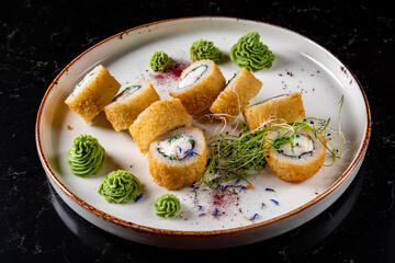 set of sushi roll in plate