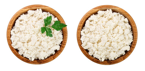 Cottage cheese in a wooden bowl isolated on a white background. Top view. Flat lay