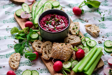Beetroot dip with fresh vegetables. top view .