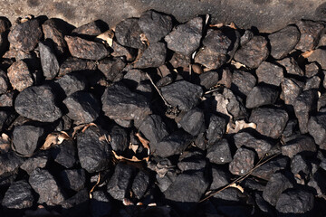 Natural black coals for background. Industrial coals.It can be used as a fuel for coal industry. Pea coal. Top view
