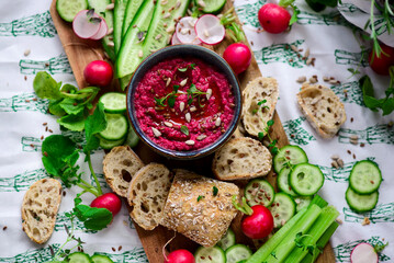 Beetroot dip with fresh vegetables. top view .