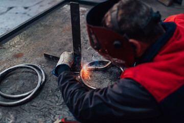 Close up of the steel welding process. Work in the heavy steel industry