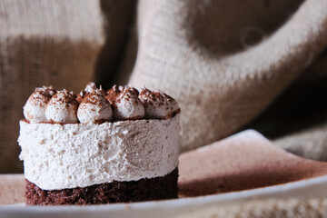 Portioned tiramisu cake. Airy creamy curd biscuit sweetness.
Dessert without sugar, low-calorie. Craft pastry shop, baking recipe