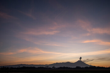 Fototapeta na wymiar Mountain silhouette view at sunrise