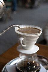 the process of preparing coffee with a filter .close-up of a cup of coffee