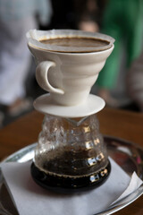 the process of preparing coffee with a filter .close-up of a cup of coffee