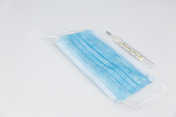 Surgical mask,Protective mask and te thermometer.
