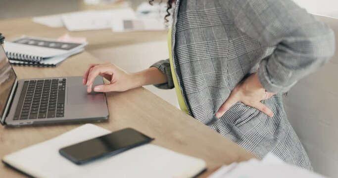 Back pain, office and hands of business woman with laptop with strain, joint inflammation and muscle ache. Computer, stress and female worker at desk with medical injury, accident and spine problem