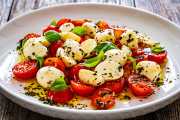 Caprese salad on wooden board

