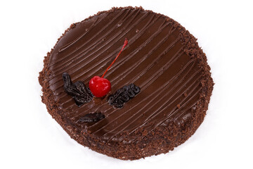 Whole round chocolate cake on a white background