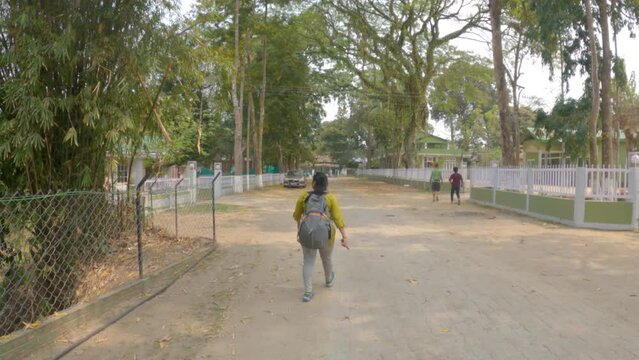 17th March, 2023, Kaziranga, Assam, India: Beautiful young female solo traveler going to heritage bungalow Banani Tourist Lodge of Assam Tourism at Kaziranga National Park, Assam.