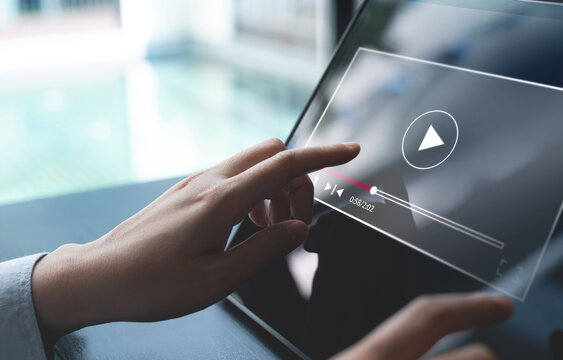 Video marketing concept. Woman playing video content online streaming, running short clip on digital tablet. Marketing technology and advertising for  online business, internet network