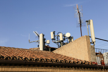 Mobile phone antennas on roofs in Spain