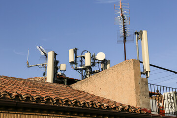 Mobile phone antennas on roofs in Spain
