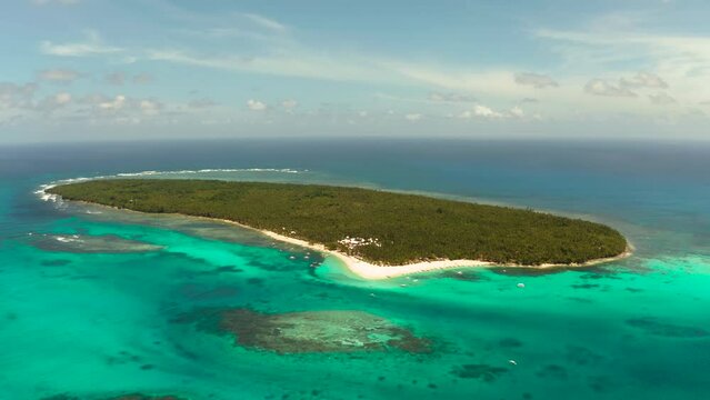 Travel concept: sandy beach on a tropical island by coral reef atoll from above. Daco island, Philippines. Summer and travel vacation concept