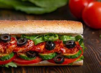 sandwich with olives and tomato, close up