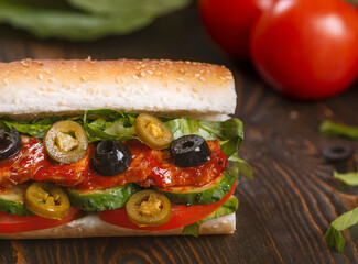 sandwich with olives and tomato, close up