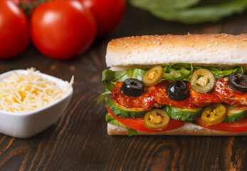 sandwich with olives and tomato, close up