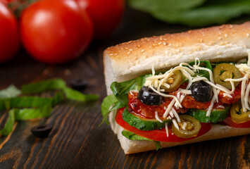 sandwich with olives and tomato, close up
