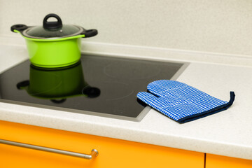 kitchen tack glove lies on the stove