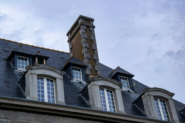 Fototapeta na wymiar old house with roof windows