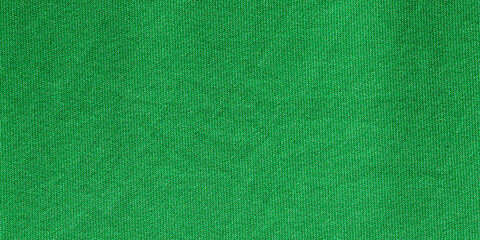 Green color sports clothing fabric football shirt jersey texture and textile background, wide banner.