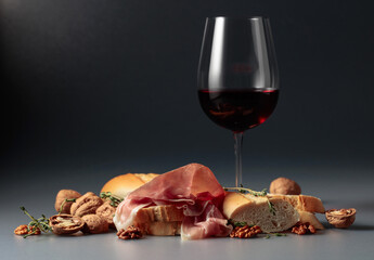 Prosciutto with red wine, baguette, walnuts, and thyme.
