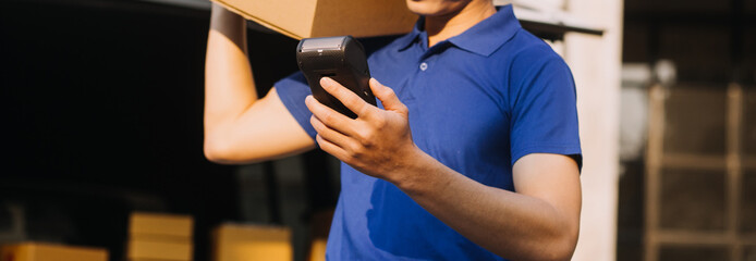 Asian business men use laptop computer checking customer order online shipping boxes at home. Starting Small business entrepreneur SME freelance