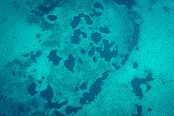 Beautiful drone view of the lake bottom of Lake Attersee, Upper Austria, Europe, with its crystal clear and turquoise greenish water