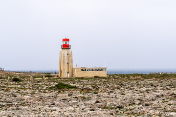 Fototapeta na wymiar lighthouse with red roof