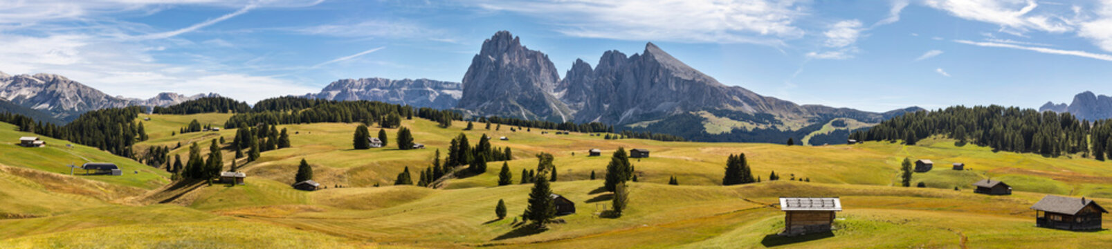 Panoramic view of Alpe di Siusi (Seiser Alm) in italian Dolomites. Ultra wide panorama. South Tyrol, Dolomites, Alps, Italy.