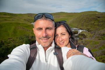 Happy man with his wife visiting Iceland in summer season