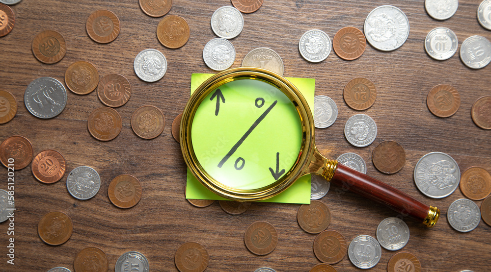 Wall mural Percentage symbol on sticky note with a coins.