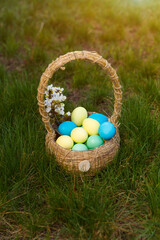 Fototapeta na wymiar Paint eggs for Easter, bright Easter holiday, children paint eggs, colored eggs in a basket, colored eggs on a stand, Holiday background 