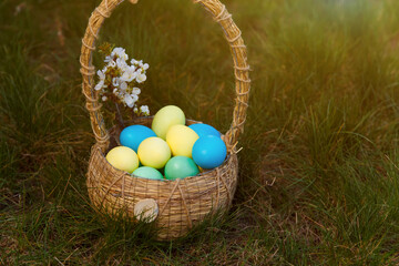 Paint eggs for Easter, bright Easter holiday, children paint eggs, colored eggs in a basket, colored eggs on a stand, Holiday background 