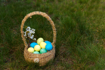 Paint eggs for Easter, bright Easter holiday, children paint eggs, colored eggs in a basket, colored eggs on a stand, Holiday background 