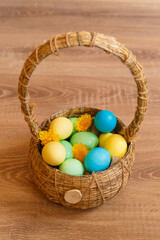 Paint eggs for Easter, bright Easter holiday, children paint eggs, colored eggs in a basket, colored eggs on a stand, Holiday background 