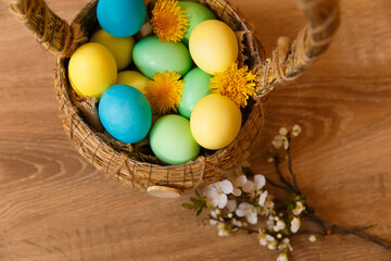 Paint eggs for Easter, bright Easter holiday, children paint eggs, colored eggs in a basket, colored eggs on a stand, Holiday background 