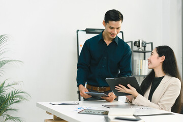 Colleagues collaborating and problem-solving in a lively discussion in the office.