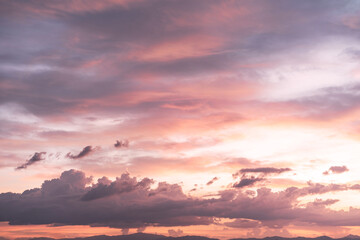 Fototapeta premium Beautiful dramatic and colorful sky at sunset over the mountains