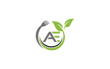 Green leaf nature with spoon and healthy logo design spoon fork and leaf