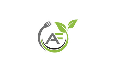 Green leaf nature with spoon and healthy logo design spoon fork and leaf